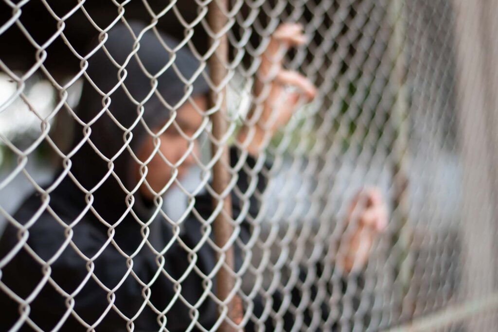 juvenile detained on other side of fence