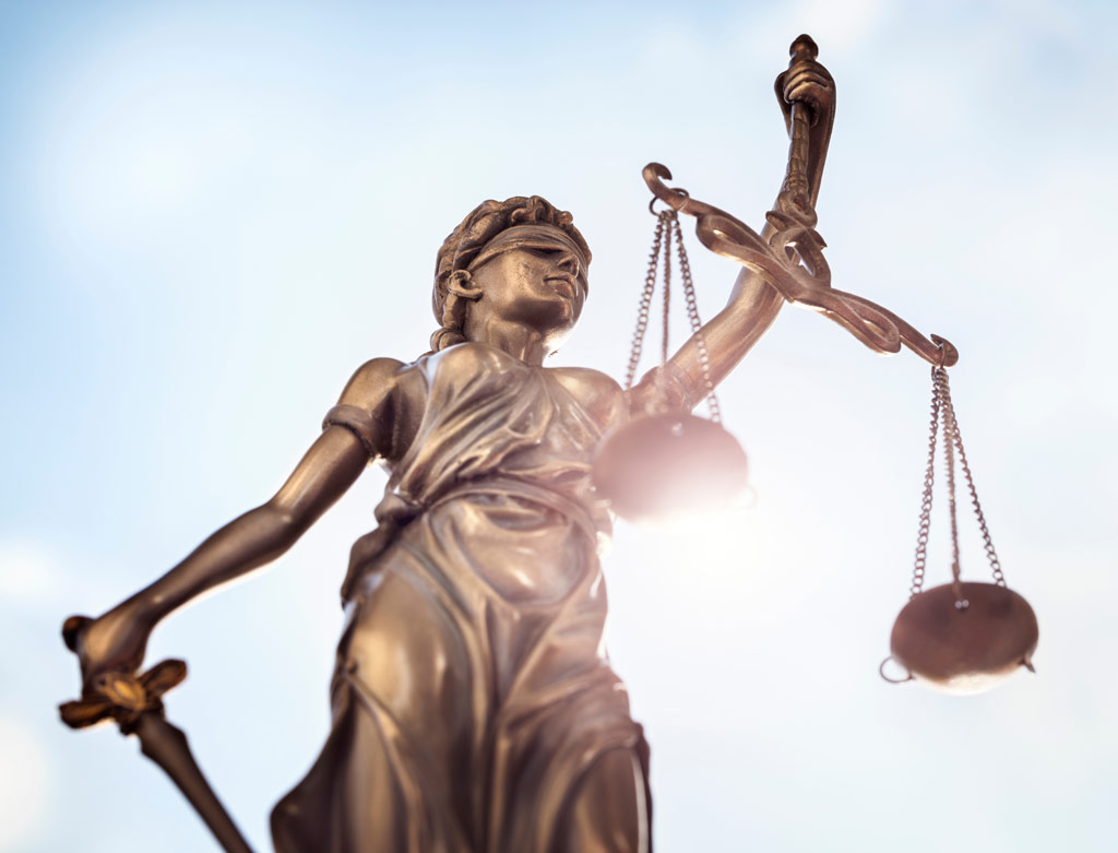 lady justice upholds the scales